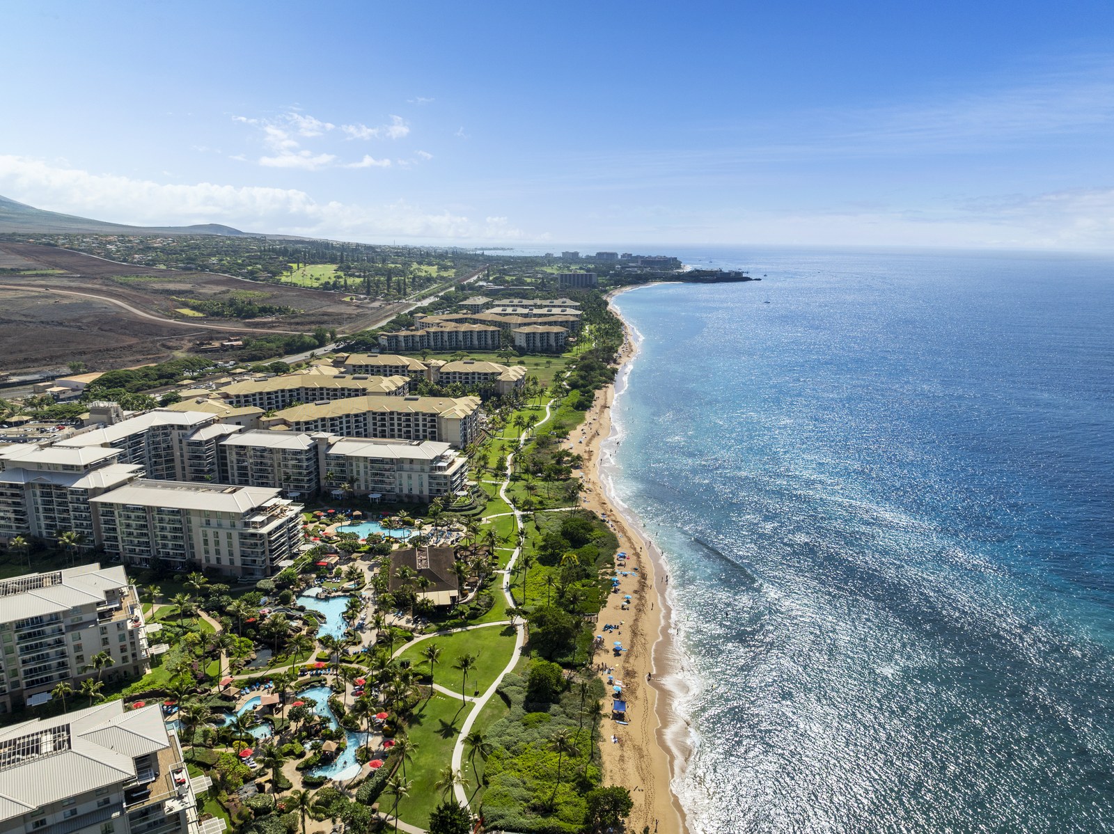 Aerial view of a Maui coastline and resort community