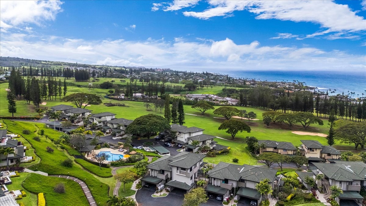 Aerial view of homes beside a Maui golf course