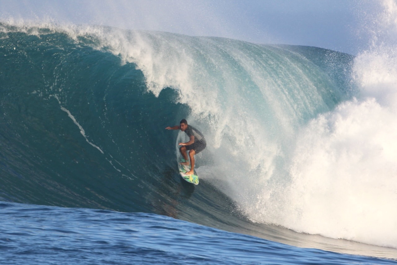 Surfer in a large breaking wave